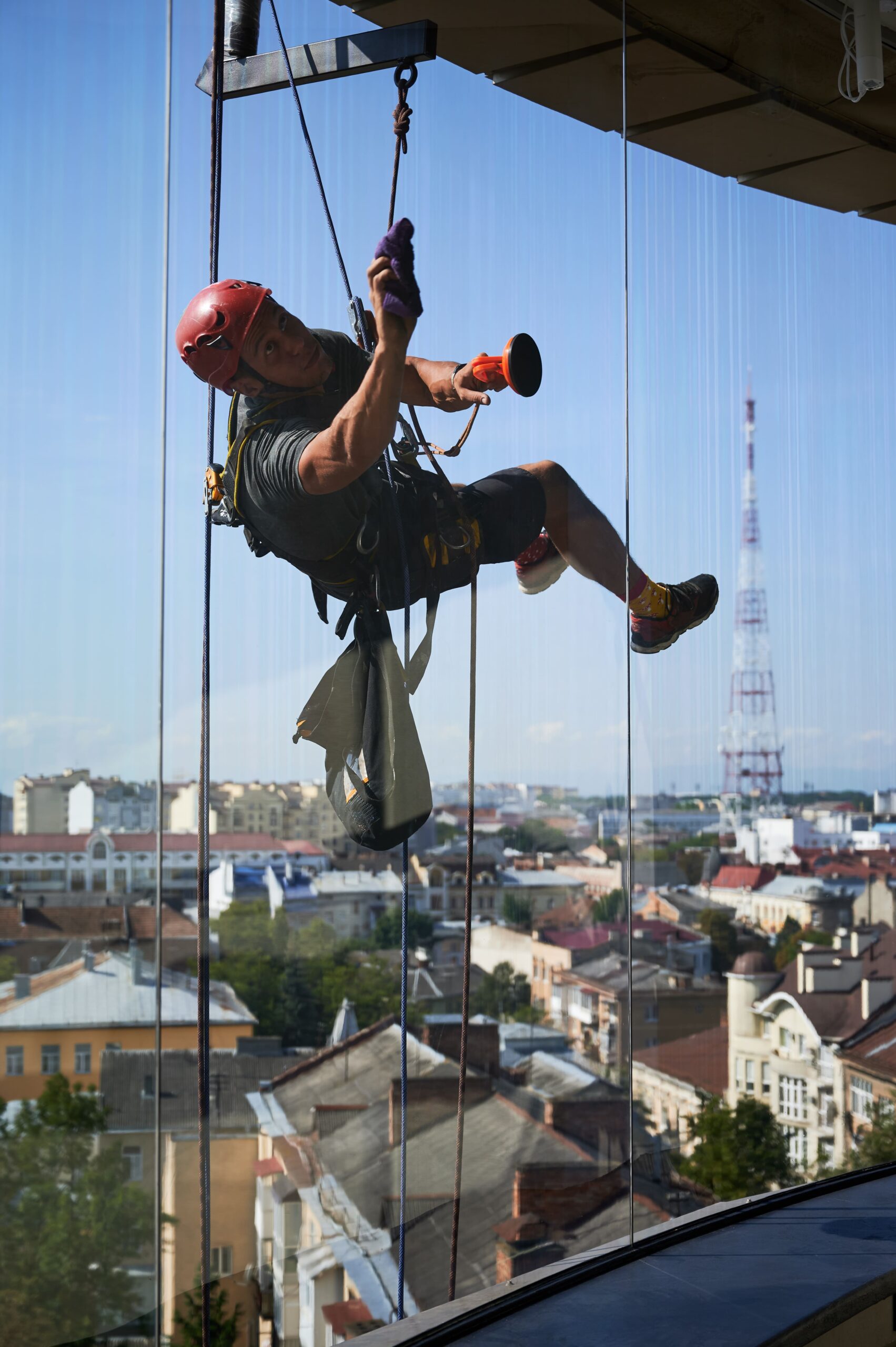 industrial-mountaineering-worker-cleaning-window-o-2025-02-24-23-03-44-utc
